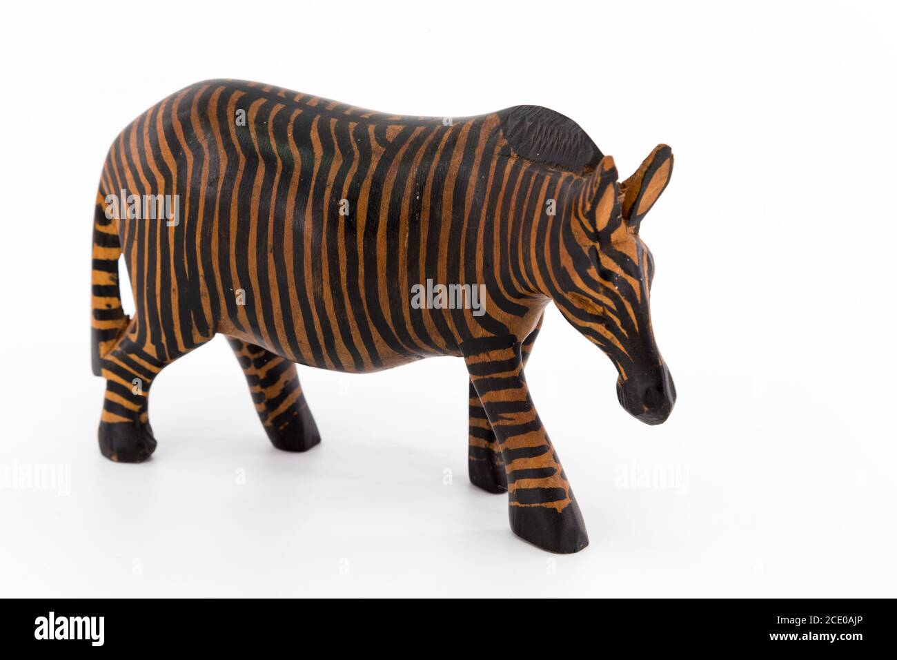 Wooden figure of a zebra on white background Stock Photo