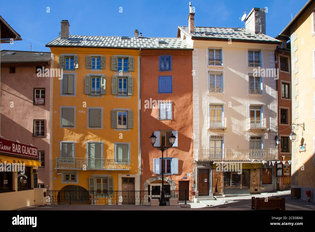 Narrow, tall, brightly painted houses in the Old Town of Briancon, Hautes-Alpes, France Stock Photo