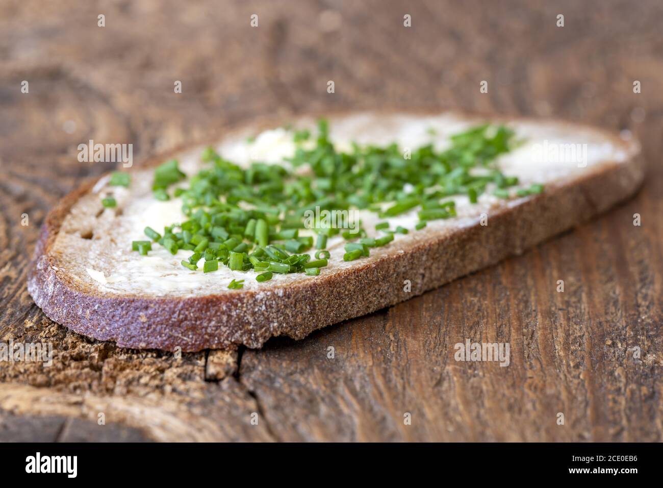 Bread With Butter And Chives On Wood Stock Photo Alamy Bread With Butter And Chives On Wood Stock Photo Alamy