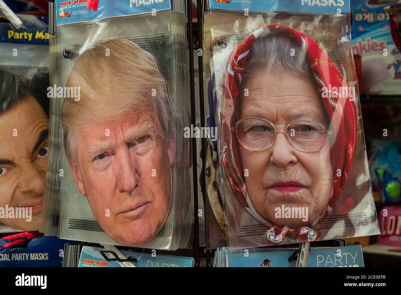 Windsor, Berkshire, UK. 30th August, 2020. Donald Trump and Her Majesty the Queen cardboard face masks for sale in a tourist shop in Windsor. Credit: Maureen McLean/Alamy Stock Photo