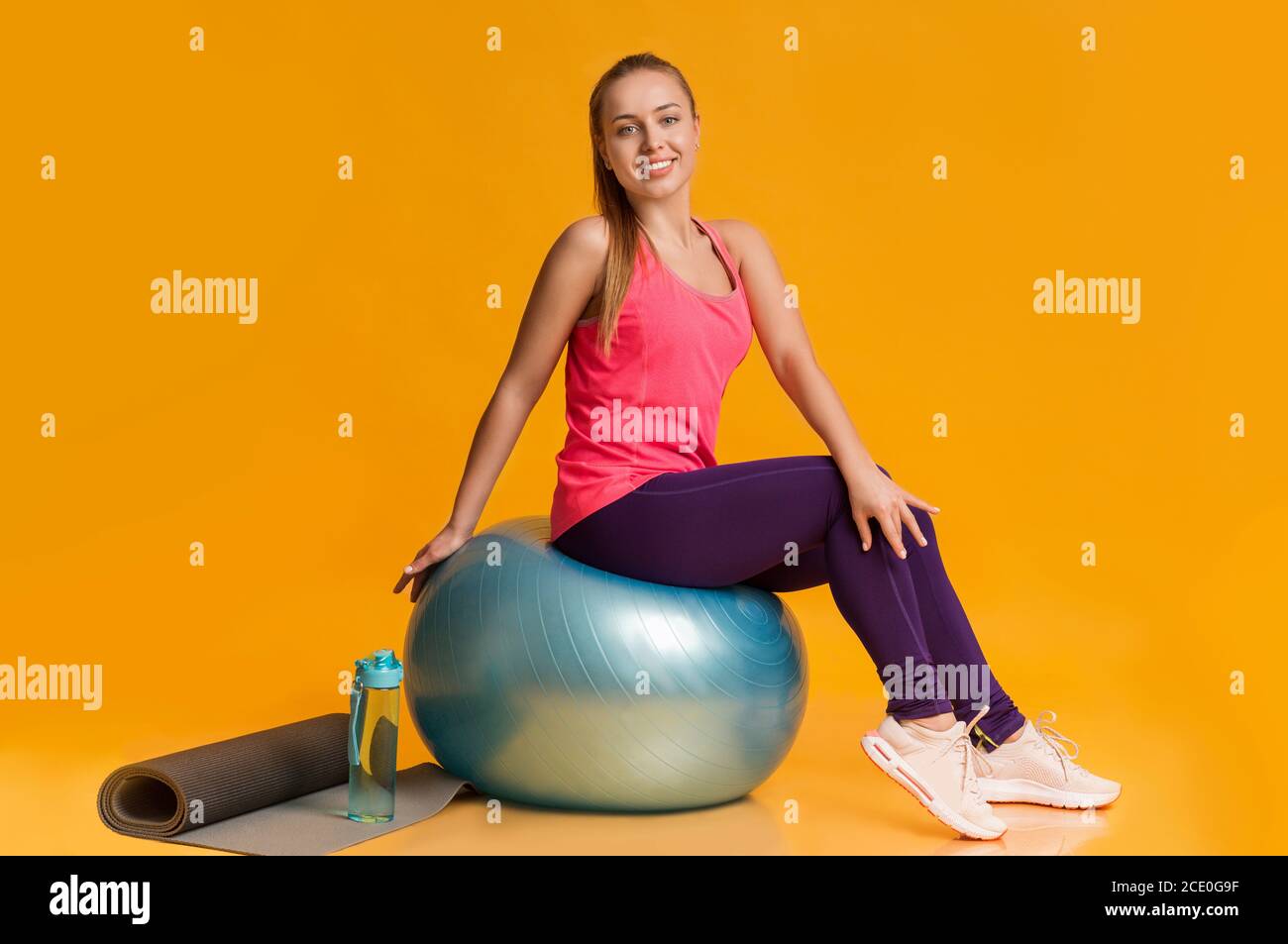 Smiling Girl Sitting On Fitness Ball Ready For Workout Stock Photo Alamy