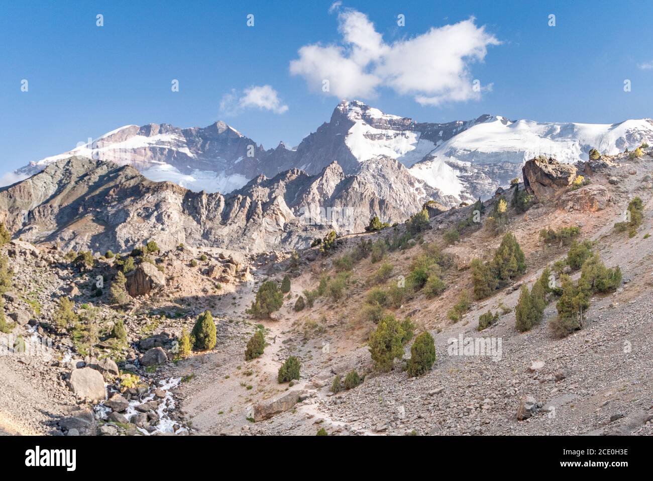 The beautiful mountain treking road with clear blue sky and rocky hills in Fann mountains in Tajikistan Stock Photo