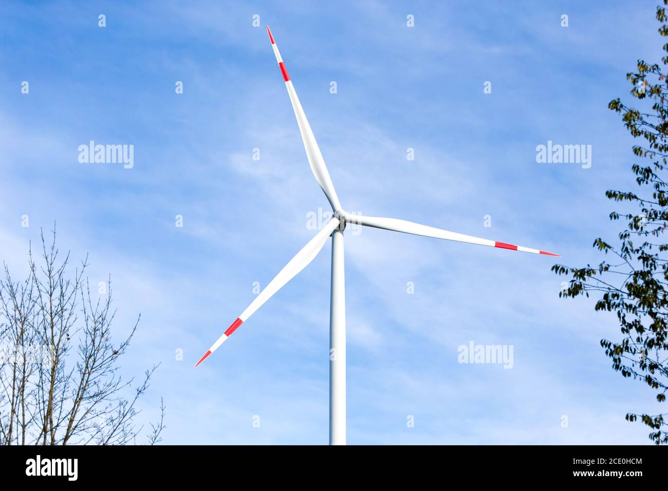 Wind turbine with a blue sky in the background Stock Photo - Alamy