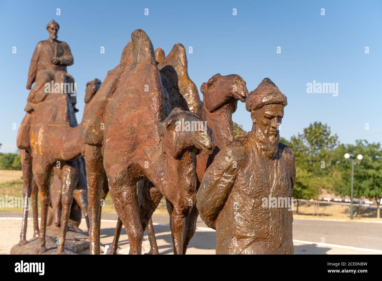 The old bronze statue of camels caravan in Uzbekistan, Samarkand Stock Photo