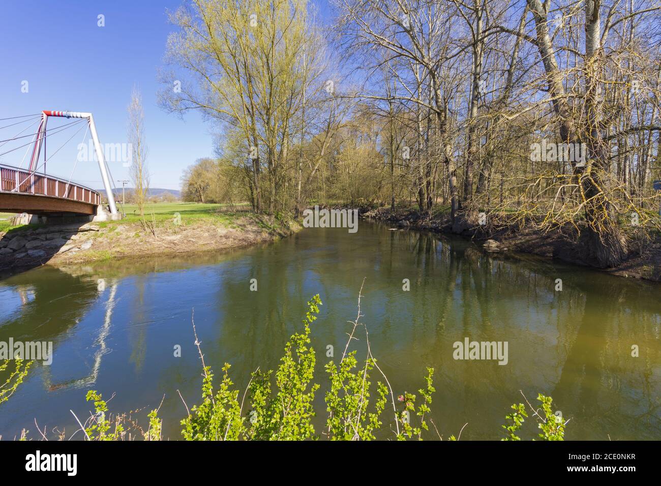 Source Riviere Main View into the source river Weißer Main with the pedestrian bridge over ...
