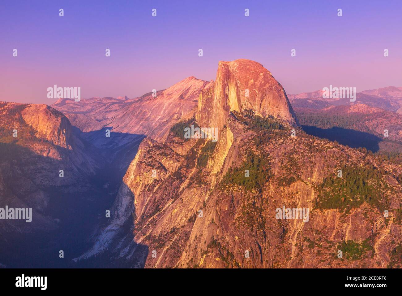 sunset close-up of Half Dome from Glacier Point lookout in Yosemite National Park, California, United States of America. View from Glacier Point: Half Stock Photo