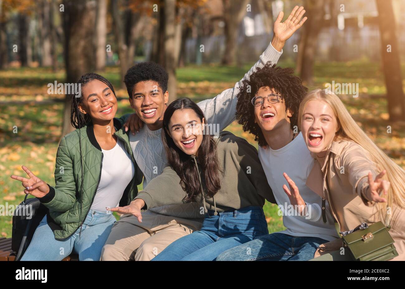 Emotional international group of teenagers posing at park Stock Photo