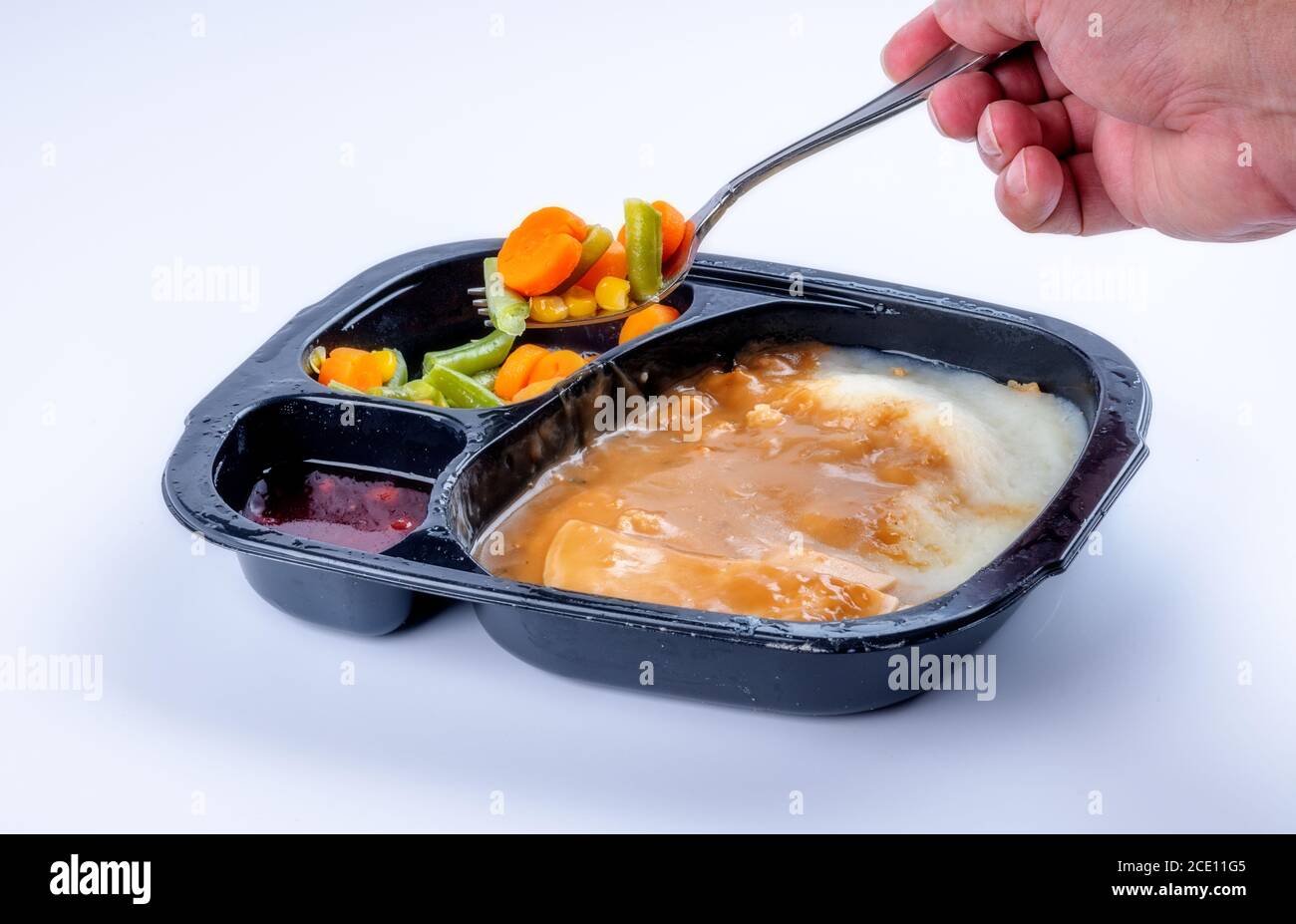 Vegetables scooped out of a TV dinner tray Stock Photo Alamy