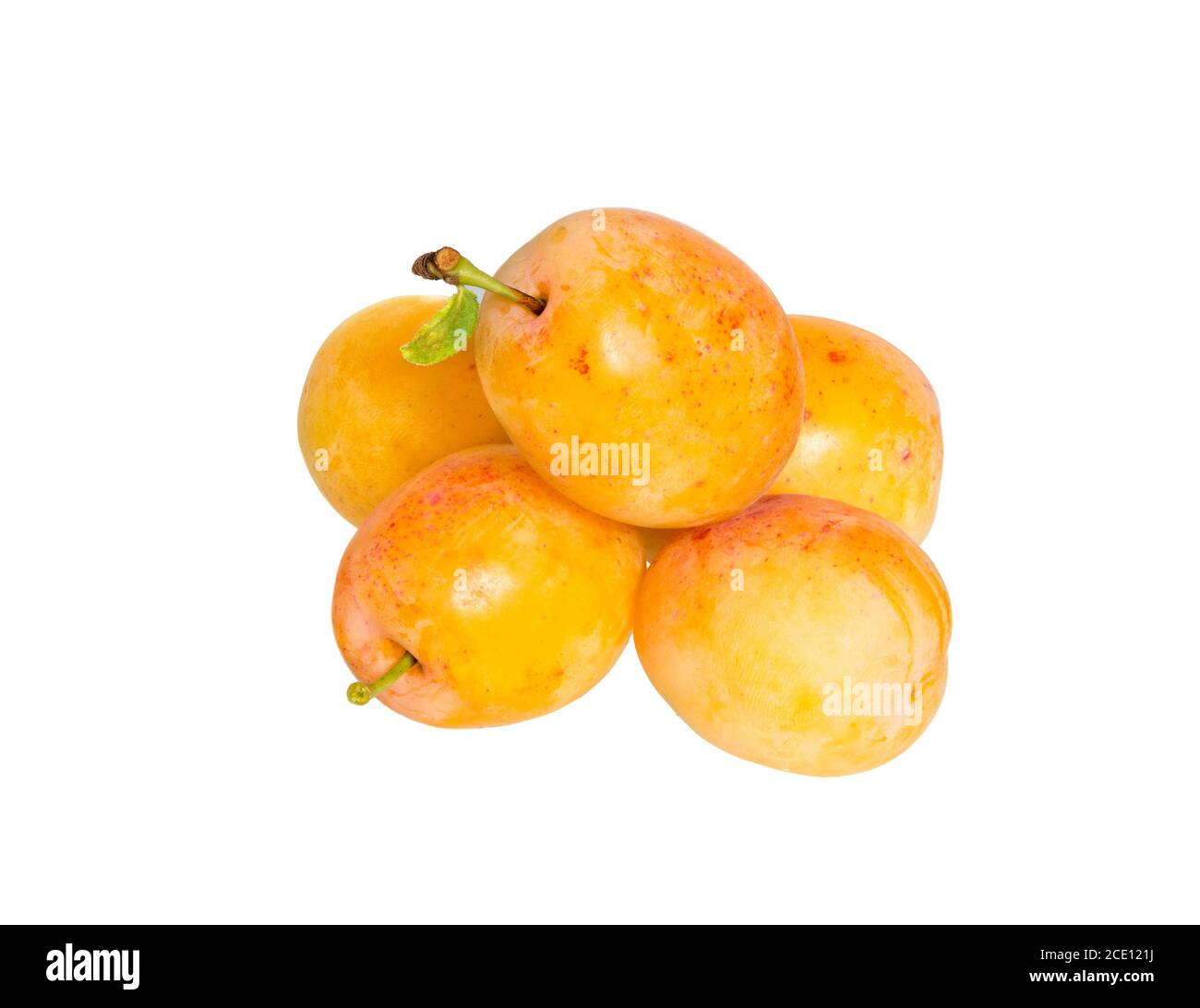 Plums isolated on White Background. Juicy yellow plums heap close up. Stock Photo