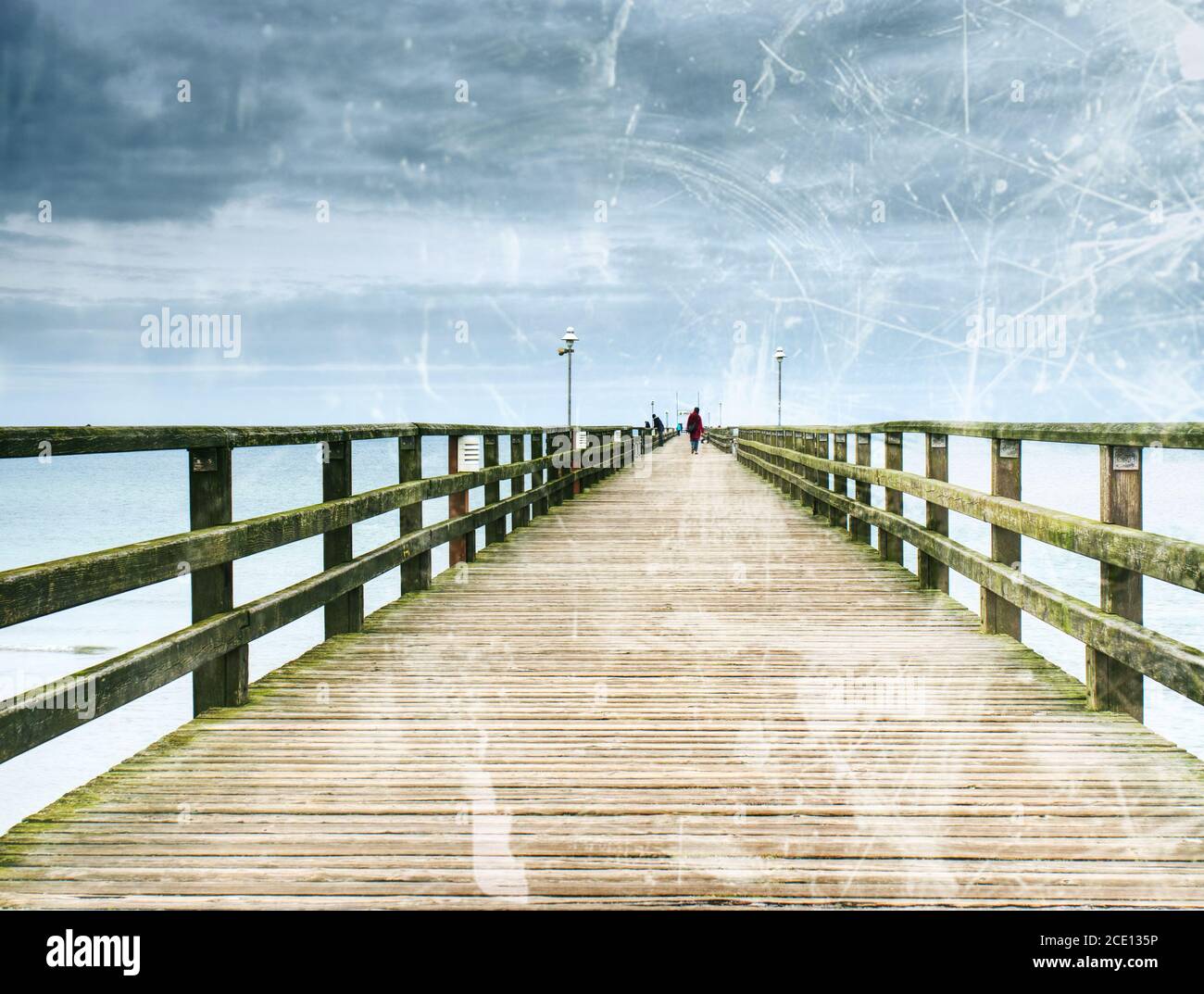 Abstract. Old wood beach bridge in Goehren with nobody. Autumnal mist Stock Photo