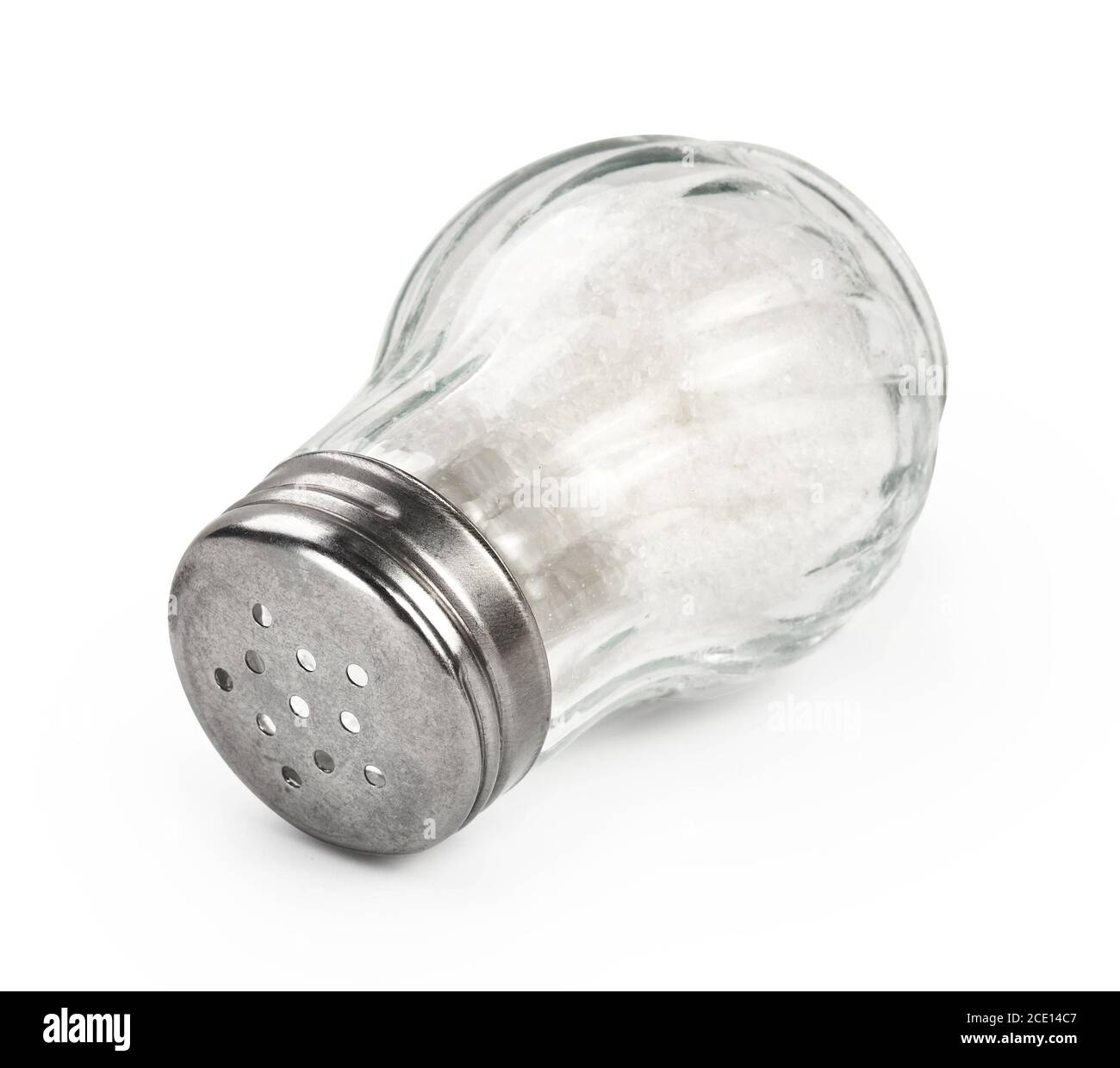 Salt shaker isolated on white background. Salt in glass bottle. Stock Photo