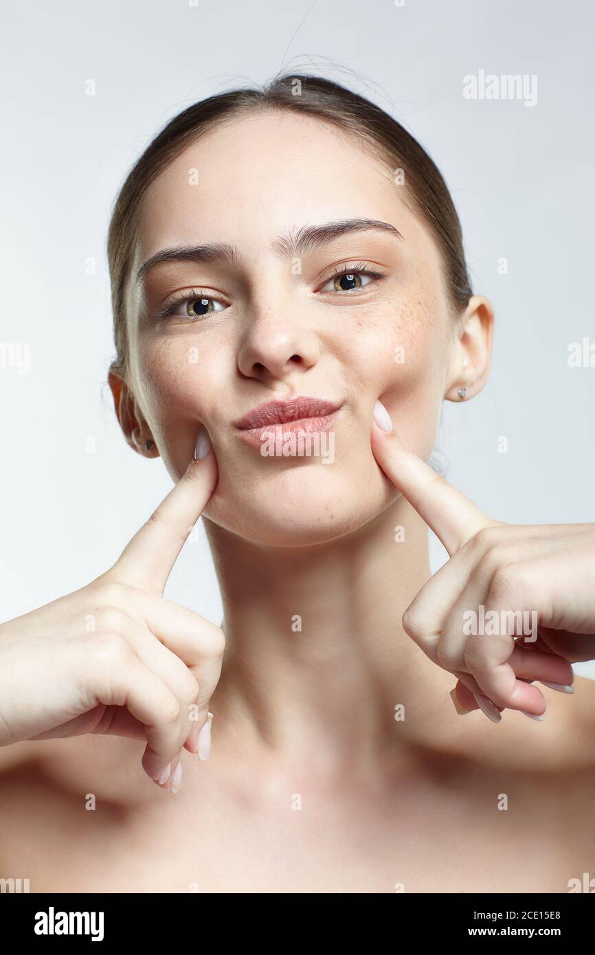 Headshot of emotional female face portrait with facial expression. Stock Photo