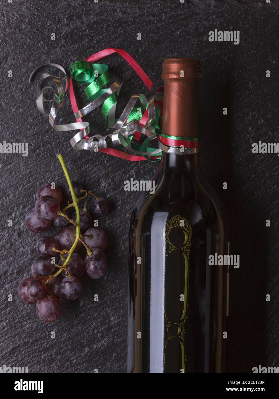 Bottle of wine with grapes Stock Photo