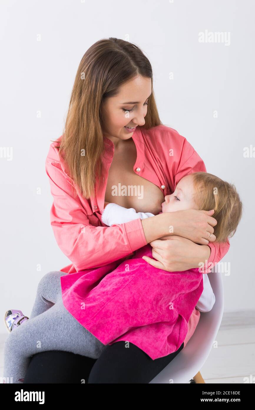 Beautiful mother breastfeeding 2025