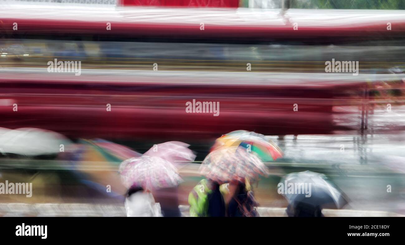 Blur night bus in rainy weather in Southeast Asia. Stock Photo