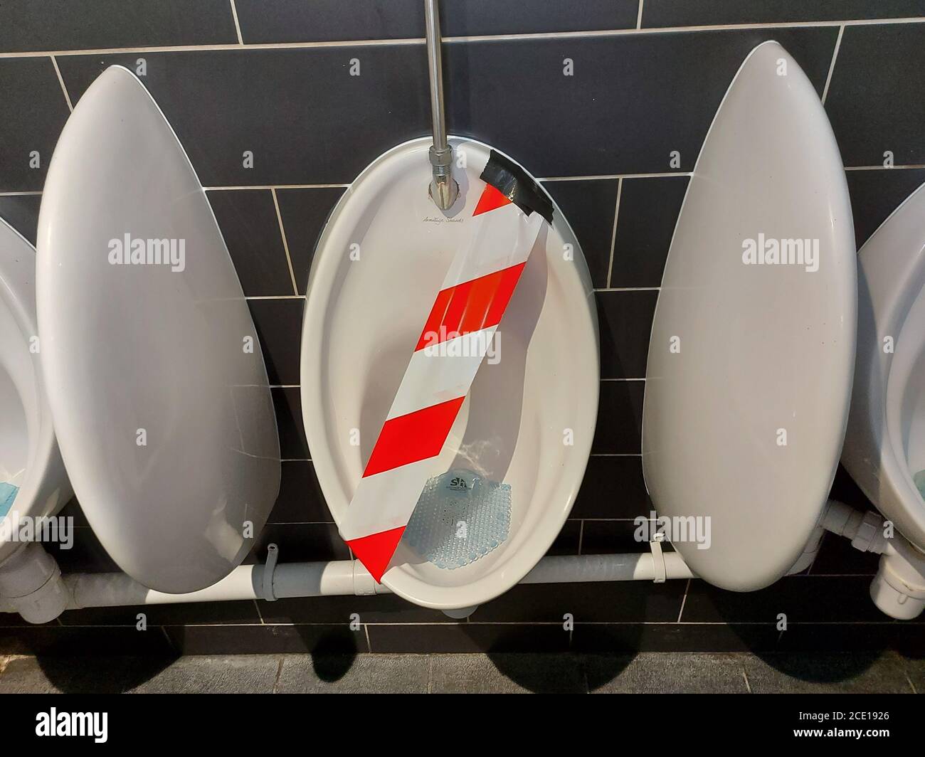 Out of order gents urinals Stock Photo - Alamy