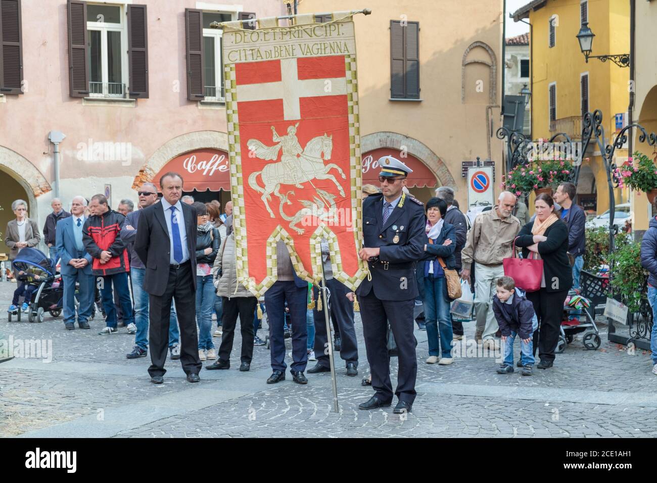 Community procession with dignitaries in the small town of Bene Vagienna, Cuneo, Italy Stock Photo