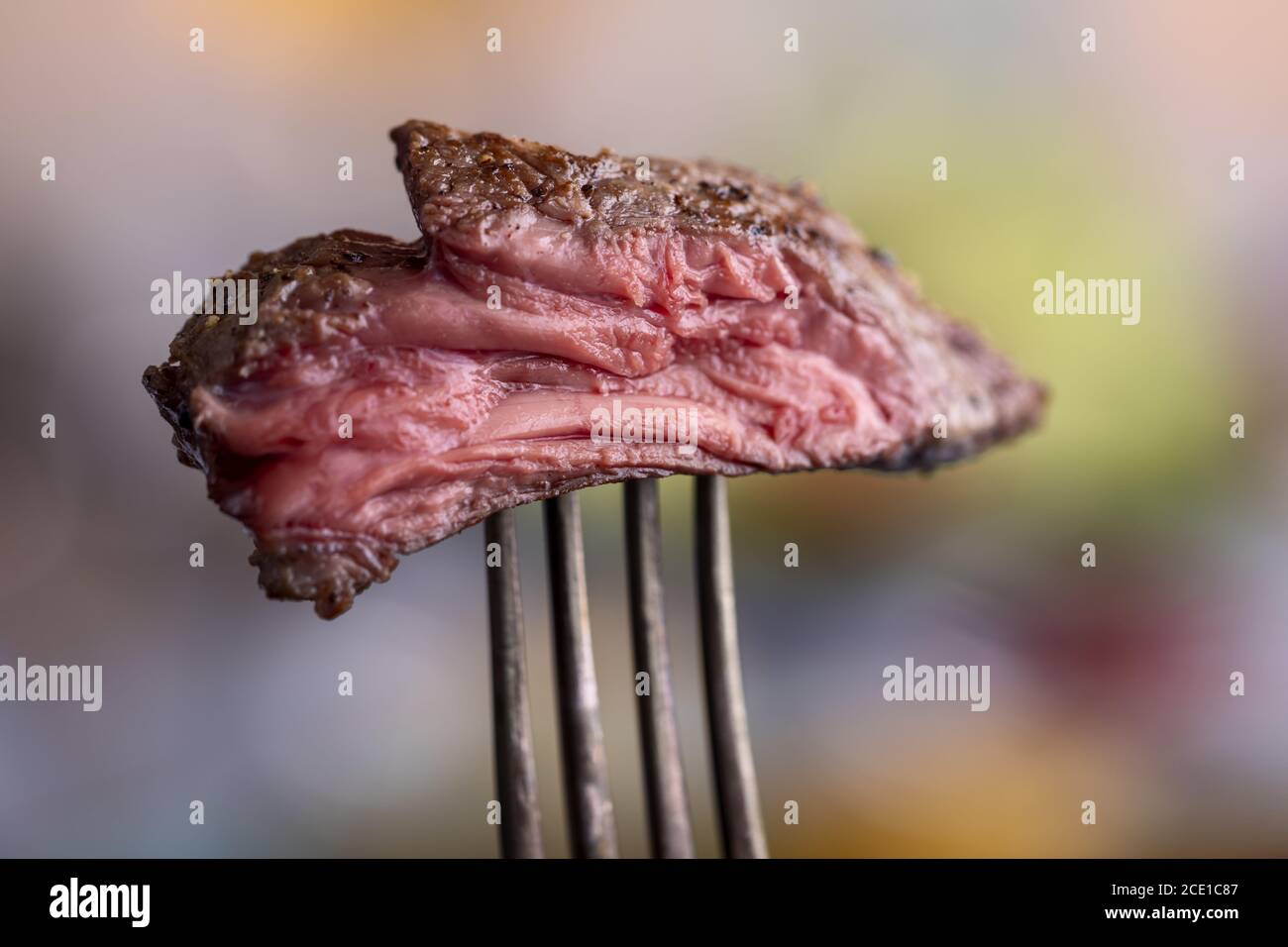 Steak on a fork Stock Photo Alamy
