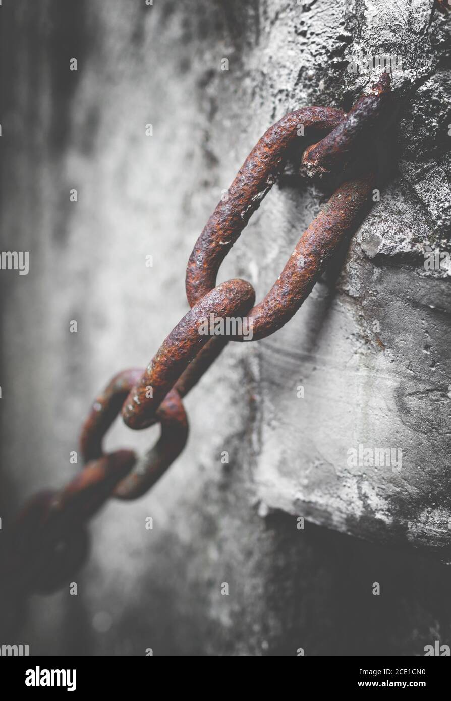 Rusty chain in the cement Stock Photo