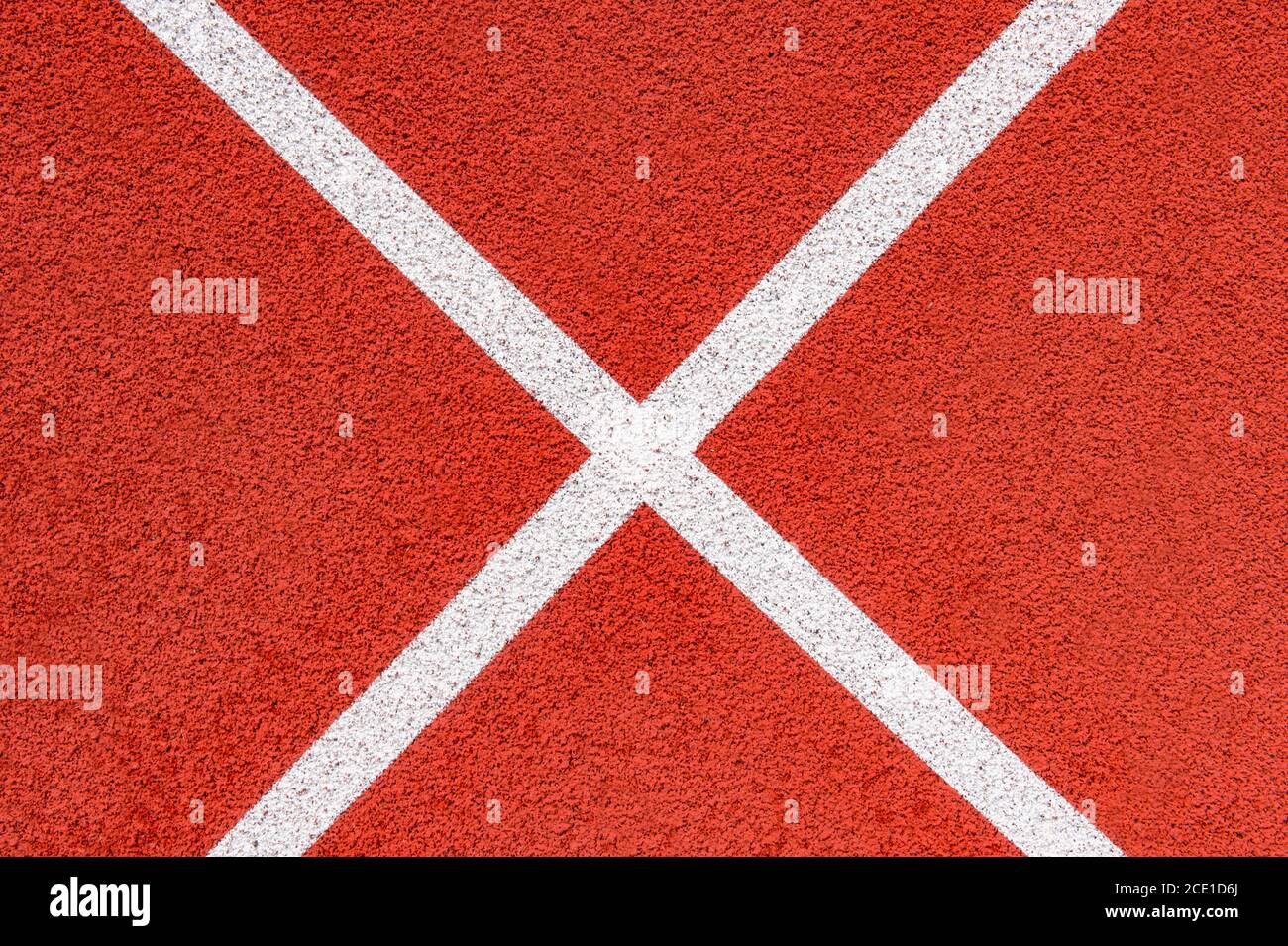 Close up on a white line in artificial red turf, on a street basketball ...