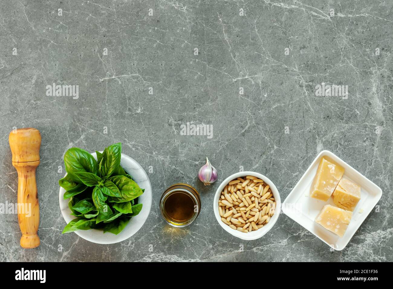 Ingredients For Pesto Top View Of Basil Pine Nuts Garlic Parmesan ingredients-for-pesto-top-view-of-basil-pine-nuts-garlic-parmesan