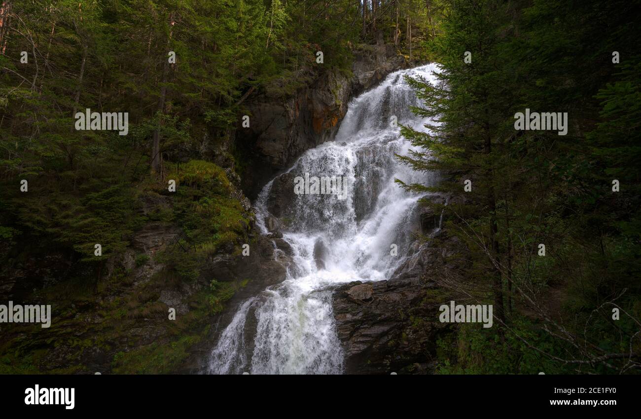 Scenic view of a waterfall in the forest Stock Photo - Alamy