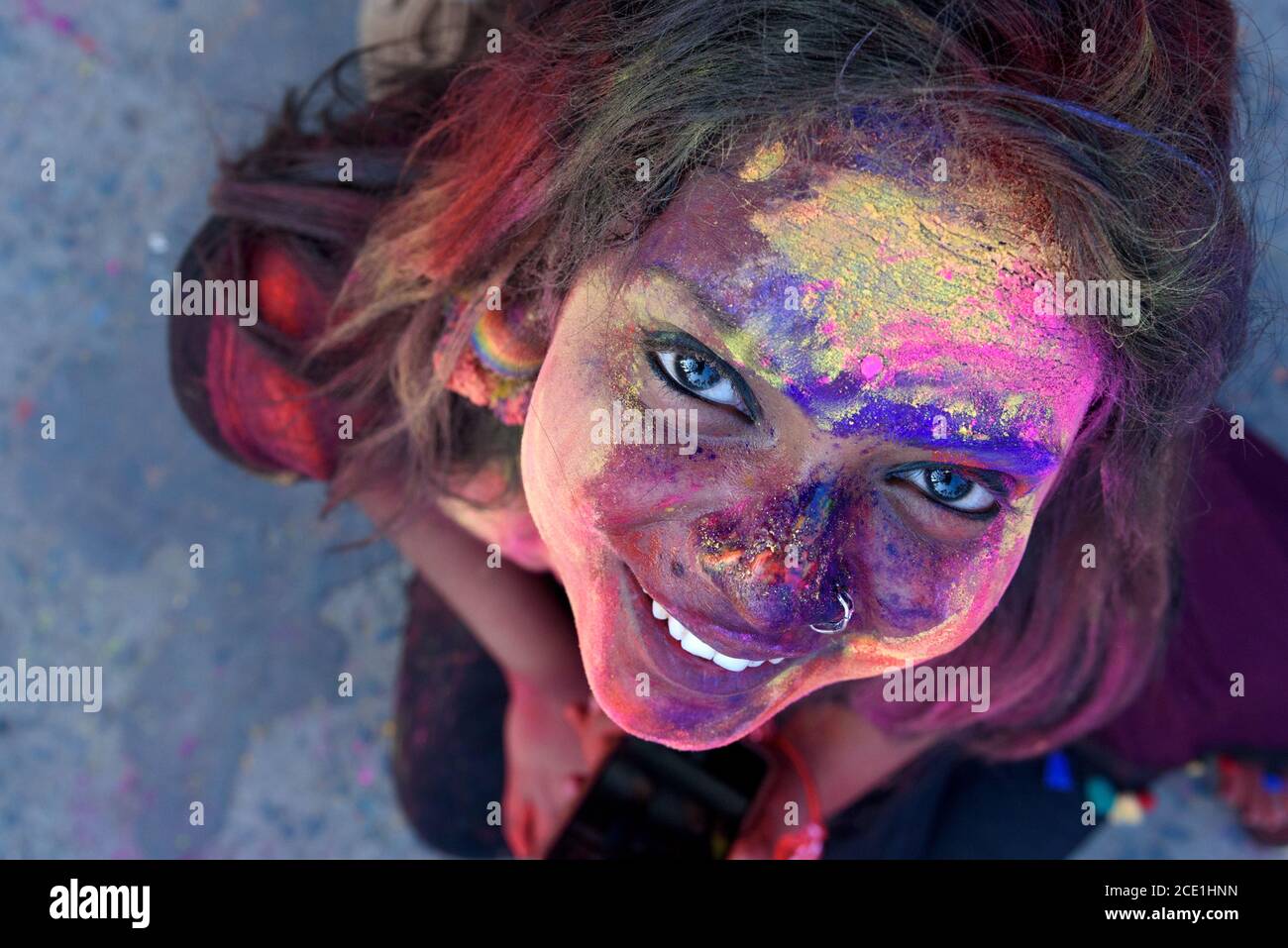 Young Indian woman celebration Holi festival in India. Stock Photo