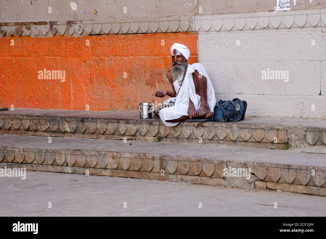 onely sadhu sitting on varanasi ganga ghat varanasi india Stock Photo
