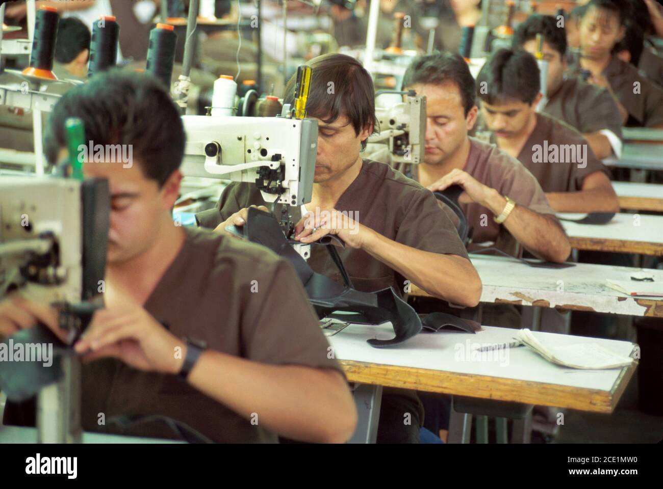 Leon Mexico,Mexicans Hispanic Guanajuato State,Emyco Shoe Factory,workers employees,working production line sewing shoes boots manufacturing plant Stock Photo