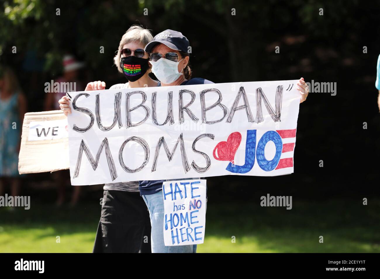 Protesters hold signs outside Trump National Golf Club, while U.S. President Donald Trump plays golf, in Sterling, Virginia, U.S., August 30, 2020. REUTERS/Cheriss May Stock Photo