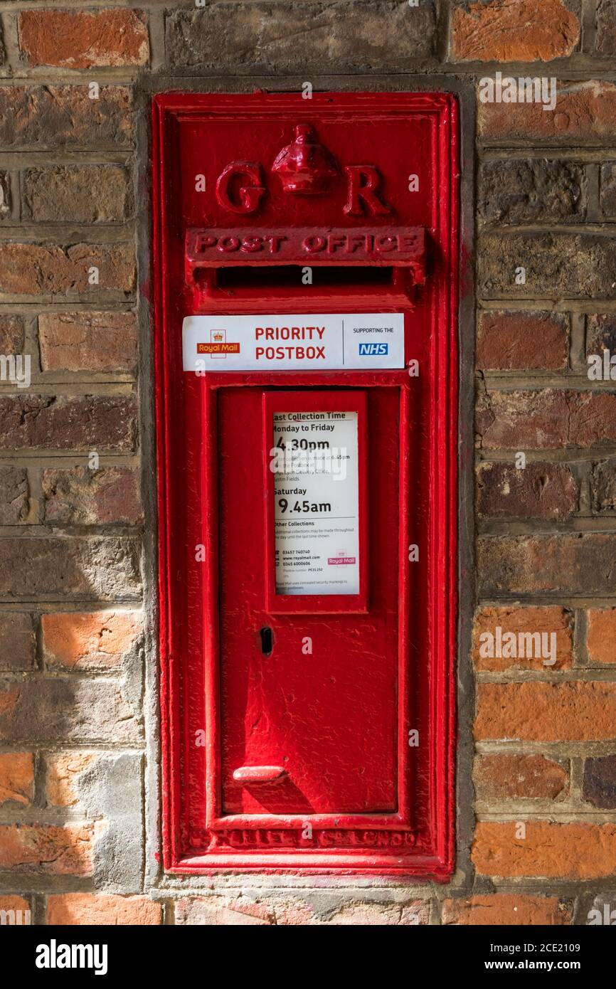 A designated Royal Mail priority postbox for returning completed coronavirus test kits, during the 2020 COVID-19 pandemic. Stock Photo