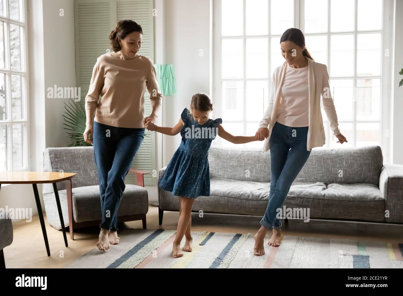 Happy three generations family domestic weekend activity. Stock Photo