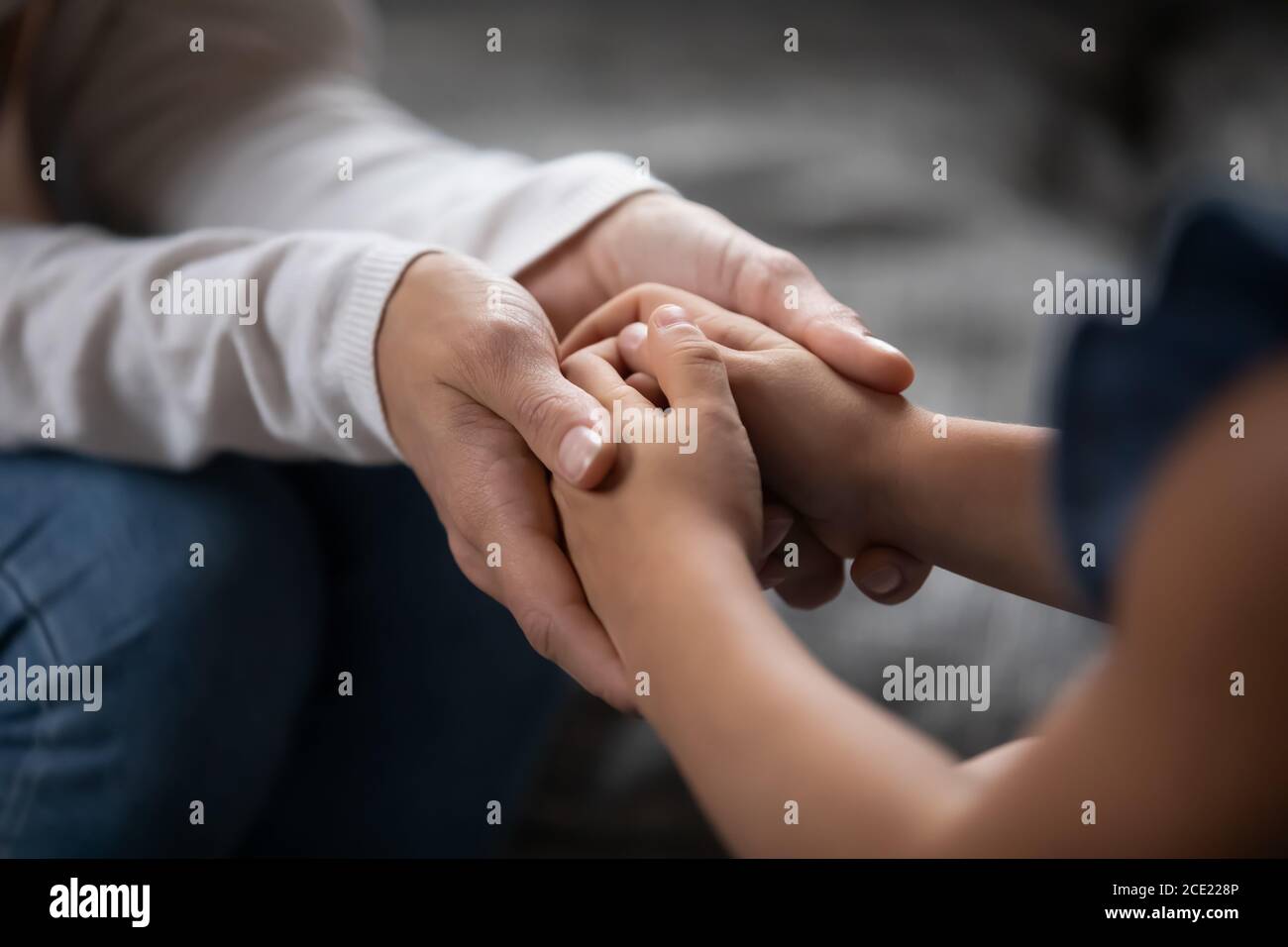 Sincere different generations family sharing secrets or making peace. Stock Photo