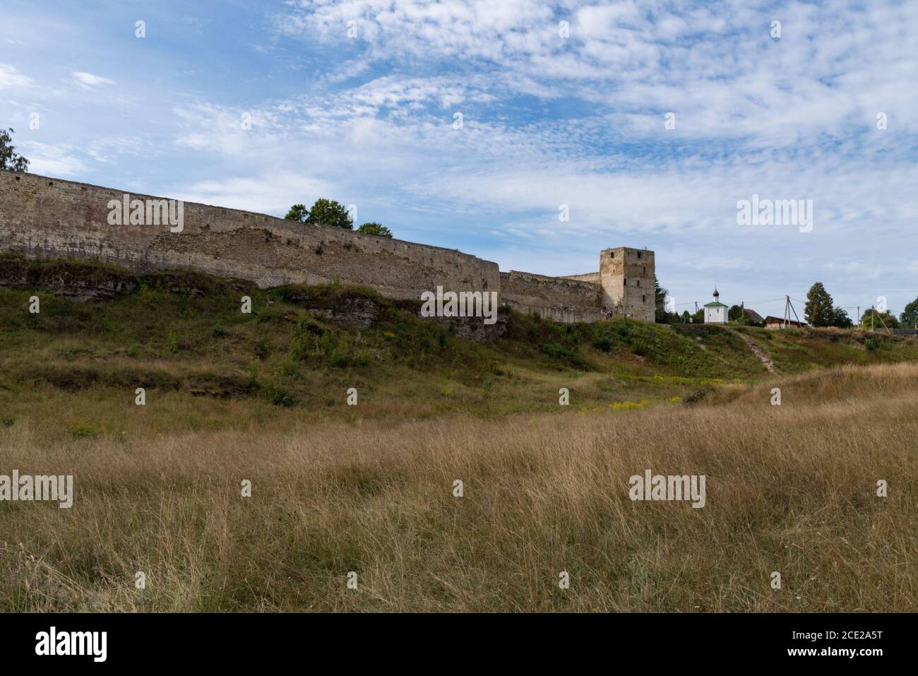 Medieval Izborsk fortress wall,  Talavskaya tower and Chapel of the Korsun Icon of the Mother of God. Izborsk, Pskov region, Russia. Stock Photo