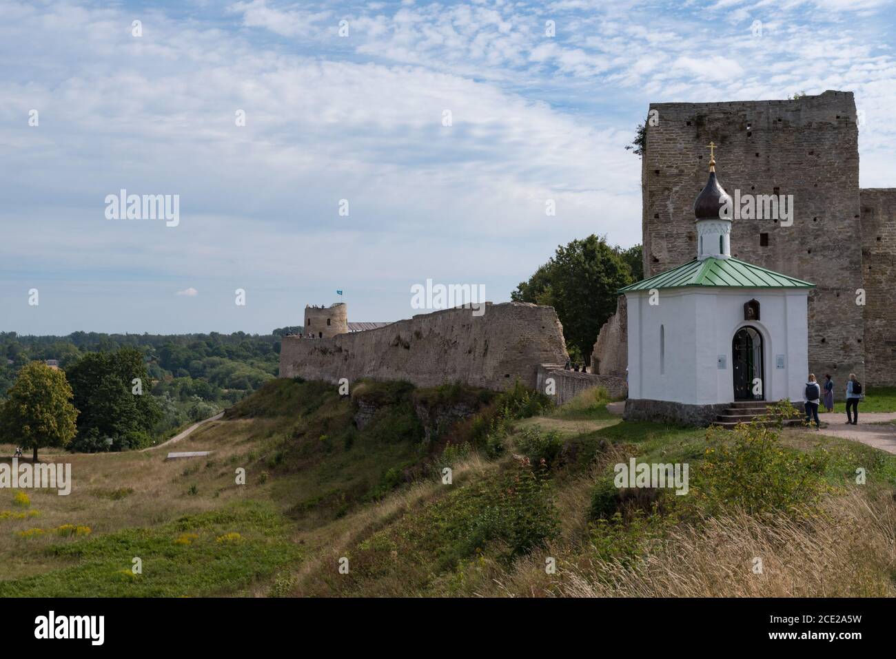 Medieval Izborsk fortress wall,  Talavskaya tower and Chapel of the Korsun Icon of the Mother of God. Izborsk, Pskov region, Russia. Stock Photo