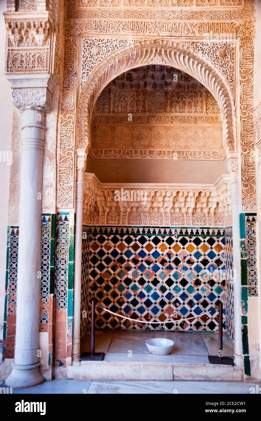 Geometric tile patterns, arabesque and calligraphic inscriptions at the Alhambra in Granada, Spain. Stock Photo