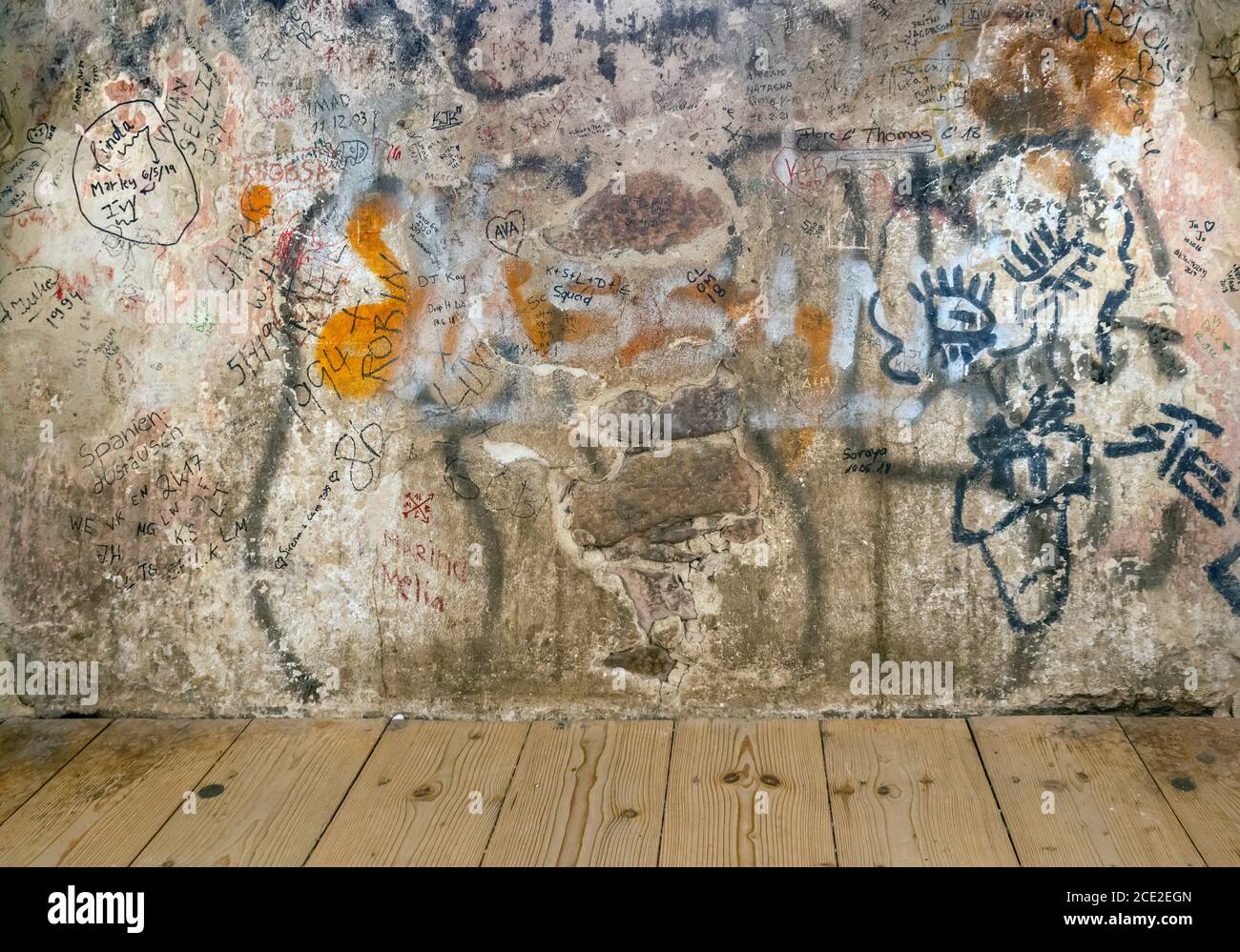 historic wall covered with lots of graffiti tags Stock Photo