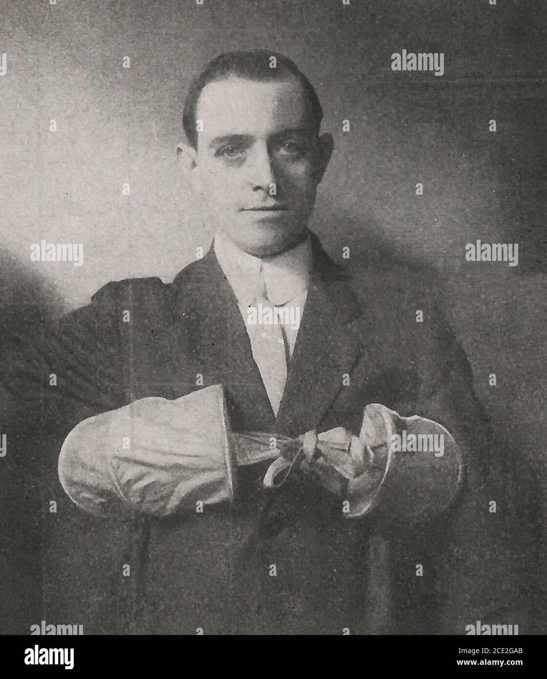 Demonstrating a life jacket, circa 1920 Stock Photo