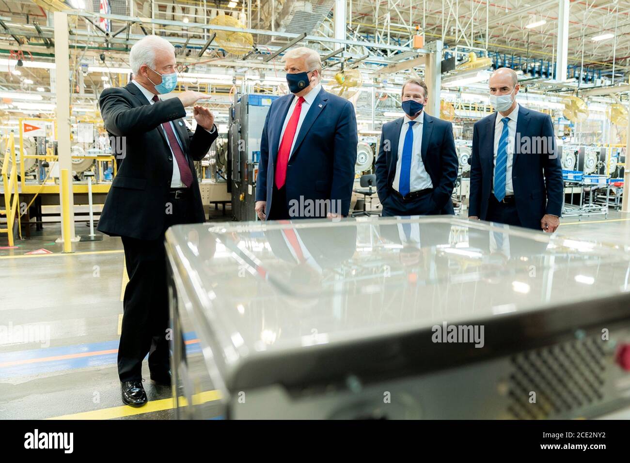 U.S. President Donald Trump, wearing a face mask, is given a tour of a Whirlpool Corporation Manufacturing Plant by VP Integrated Supply Chain and Quality Jim Keppler, left, August 6, 2020 in Clyde, Ohio. Stock Photo