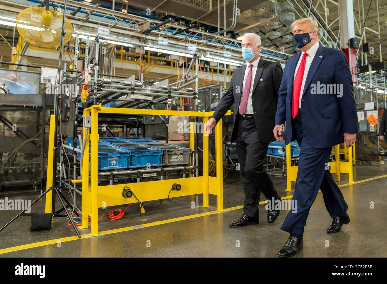 U.S. President Donald Trump, wearing a face mask, is given a tour of a Whirlpool Corporation Manufacturing Plant by VP Integrated Supply Chain and Quality Jim Keppler, left, August 6, 2020 in Clyde, Ohio. Stock Photo