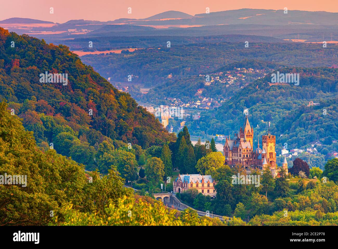 Drachenburg at twilight. Schloss Drachenburg is a private villa styled as a palace and constructed in the late 19th century. It was completed in only Stock Photo