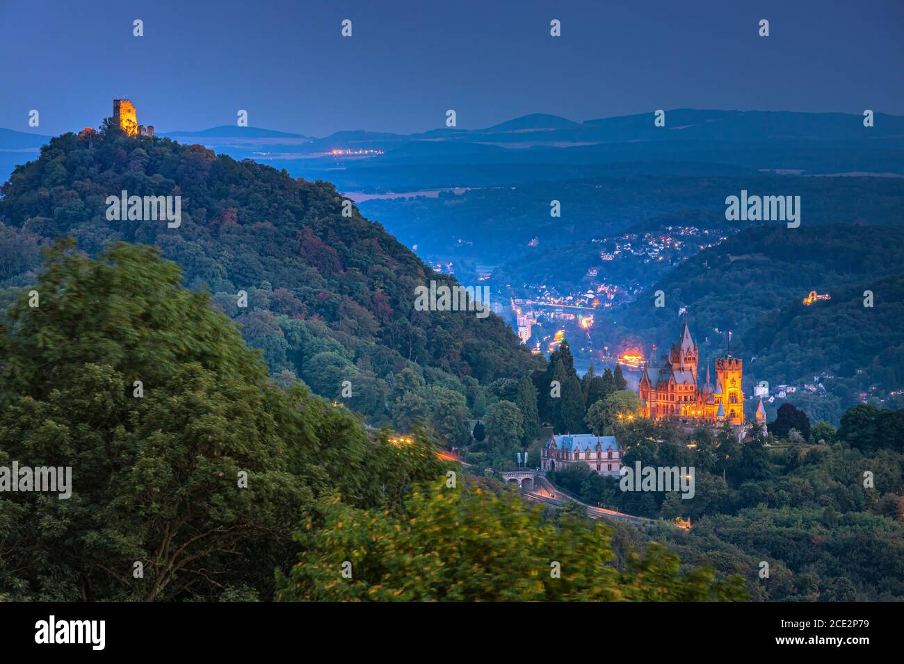 Drachenburg at twilight. Schloss Drachenburg is a private villa styled as a palace and constructed in the late 19th century. It was completed in only Stock Photo