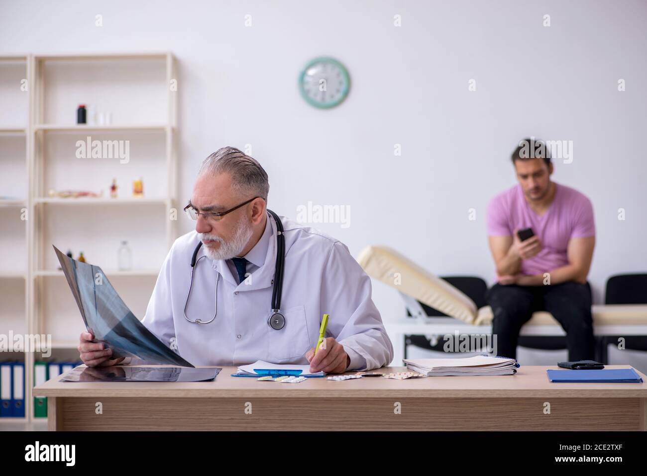 Hospital radiologist checking notes hi-res stock photography and images ...