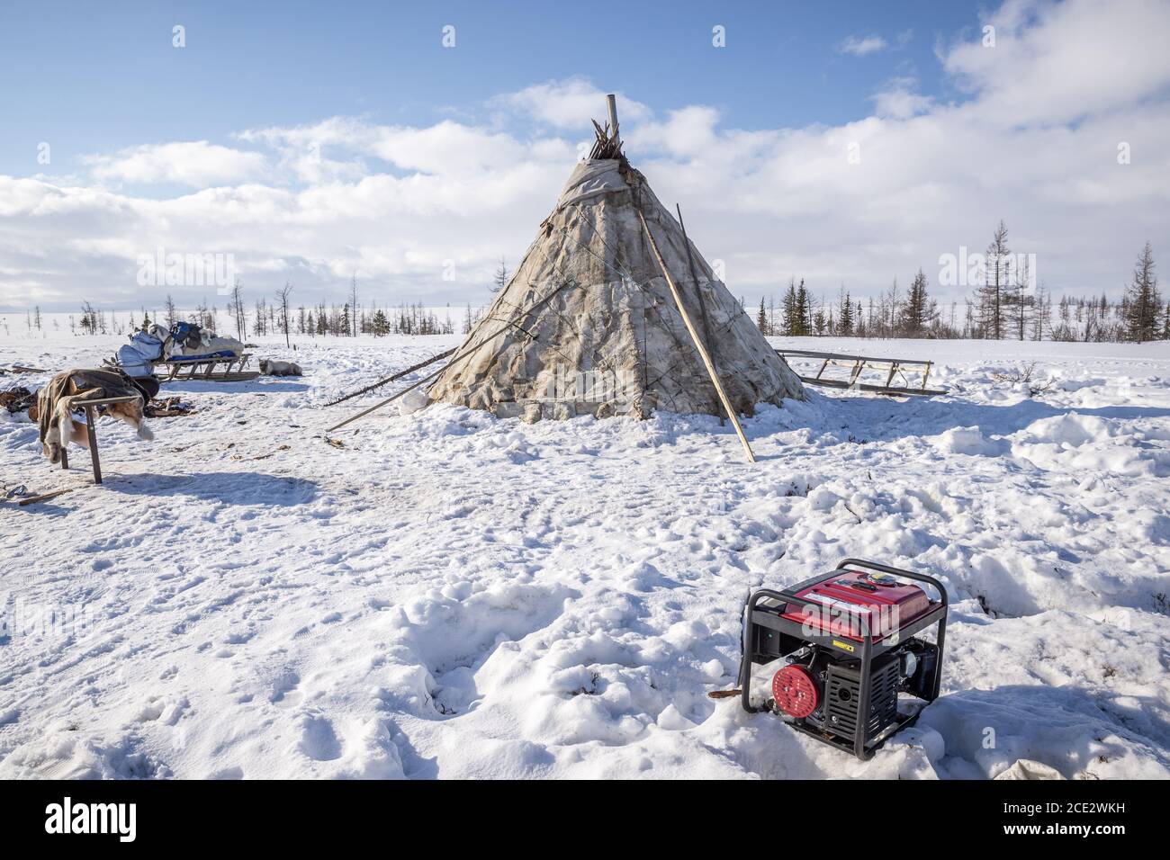 A power generator in a Nenet camp in a snowy tundra landscape, Yamalo-Nenets Autonomous Okrug, Russia Stock Photo
