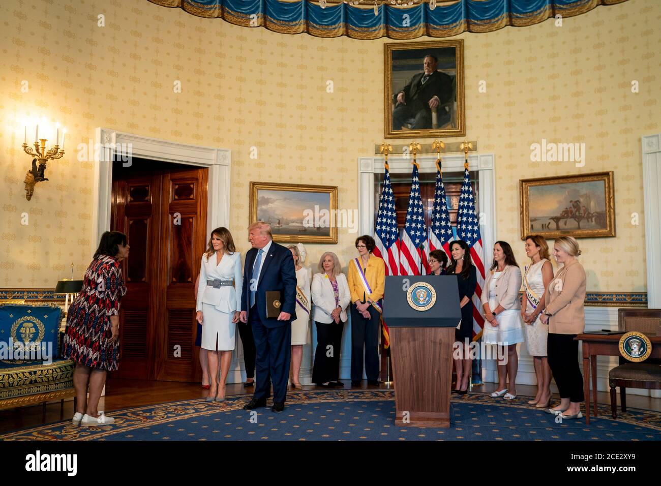 U.S. President Donald Trump acknowledges participants during an event marking the 100th Anniversary of the Ratification of the 19th Amendment in the Blue Room of the White House August 18, 2020 in Washington, DC. Stock Photo