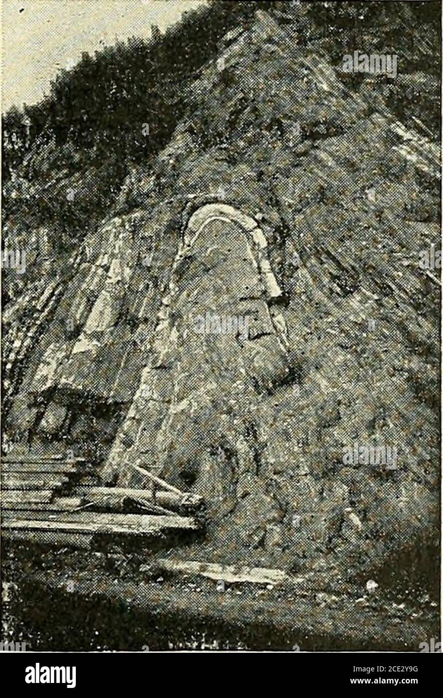 . Elementary physical geography . Fig. 93. Syncline. stood by an examinationof the accompanying fig-ures. At times the foldsare very regular (Fig. 94),but usually they are un-symmetrical (Fig. 95).They are generally ridge- Fig.. 94. Photograph of an anticline near Hancock,W. Va. like, and in the direction of theridge they gradually lose in sizeand finally disappear altogether.The direction in which these rocksenter the earth is known as thedip, while a horizontal line at rightangles to this, is known as thestrike (Figs. 92 and 93). If weconsidered one side of the gableroof of a house to repres Stock Photo
