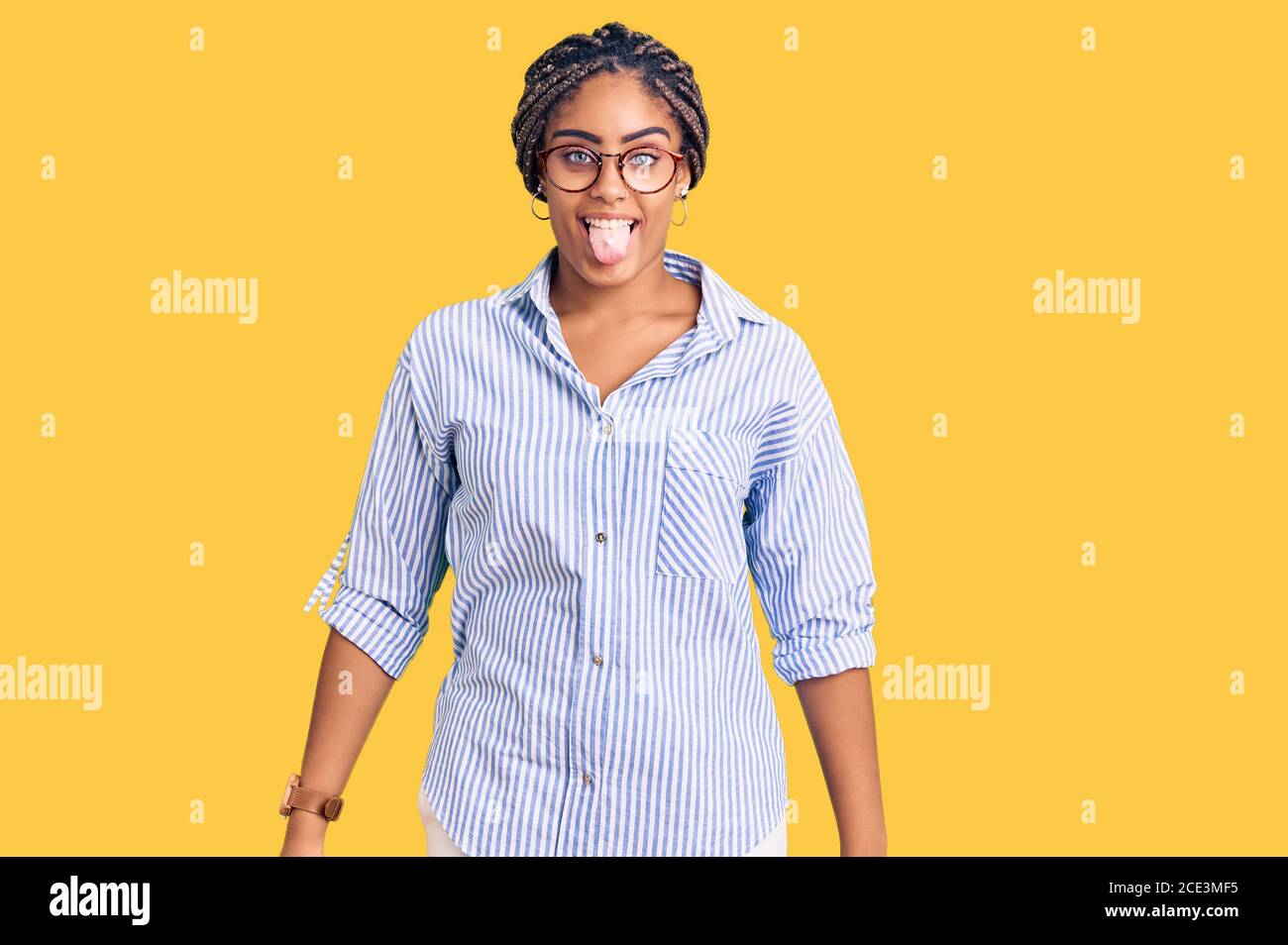 Young african american woman with braids wearing casual clothes and ...