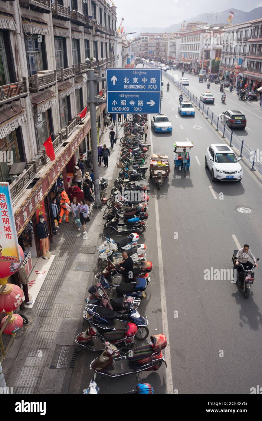 Beijing Road, the main avenue built by the Chinese through old Lhasa, Tibet Stock Photo