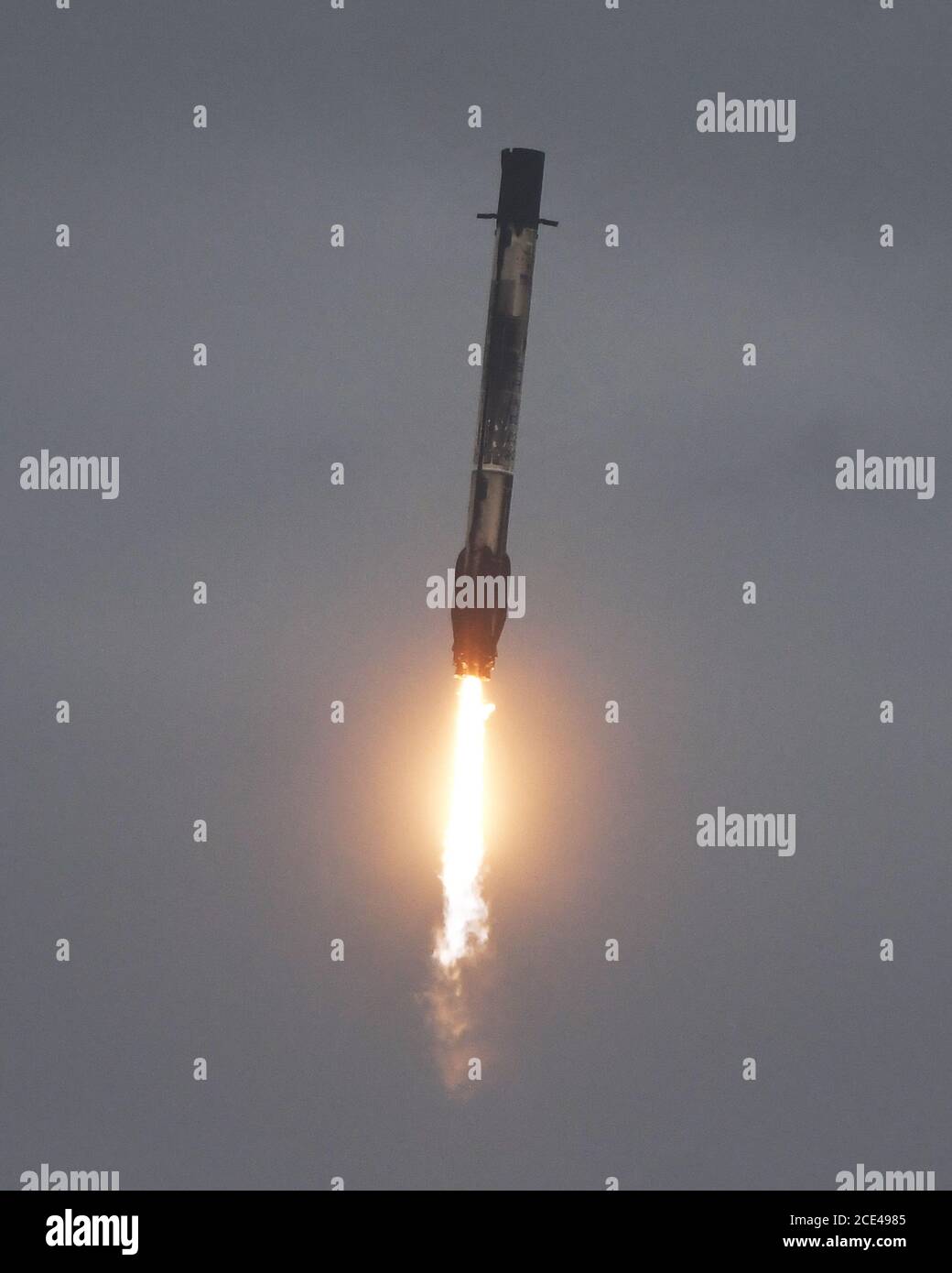 Cape Canaveral, Florida, USA. 30th Aug, 2020. The first stage of a SpaceX Falcon 9 rocket returns to Landing Zone 1 at 7:27 PM after launching from Complex 40 at the Cape Canaveral Air Force Station, Florida on Sunday, August 30, 2020. Photo by Joe Marino/UPI Credit: UPI/Alamy Live News Credit: UPI/Alamy Live News Stock Photo