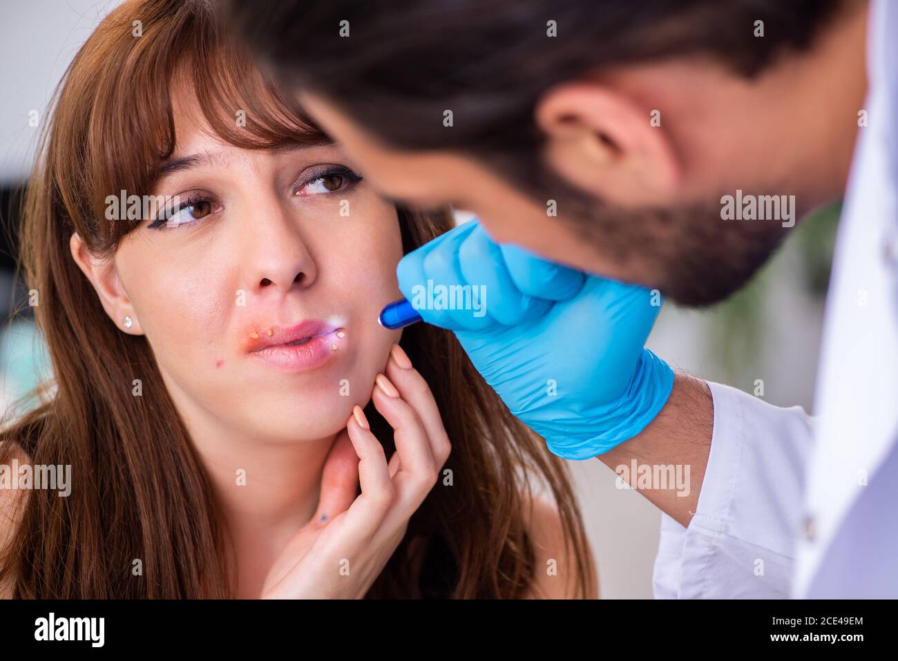 Young woman visiting doctor dermatologist Stock Photo Alamy